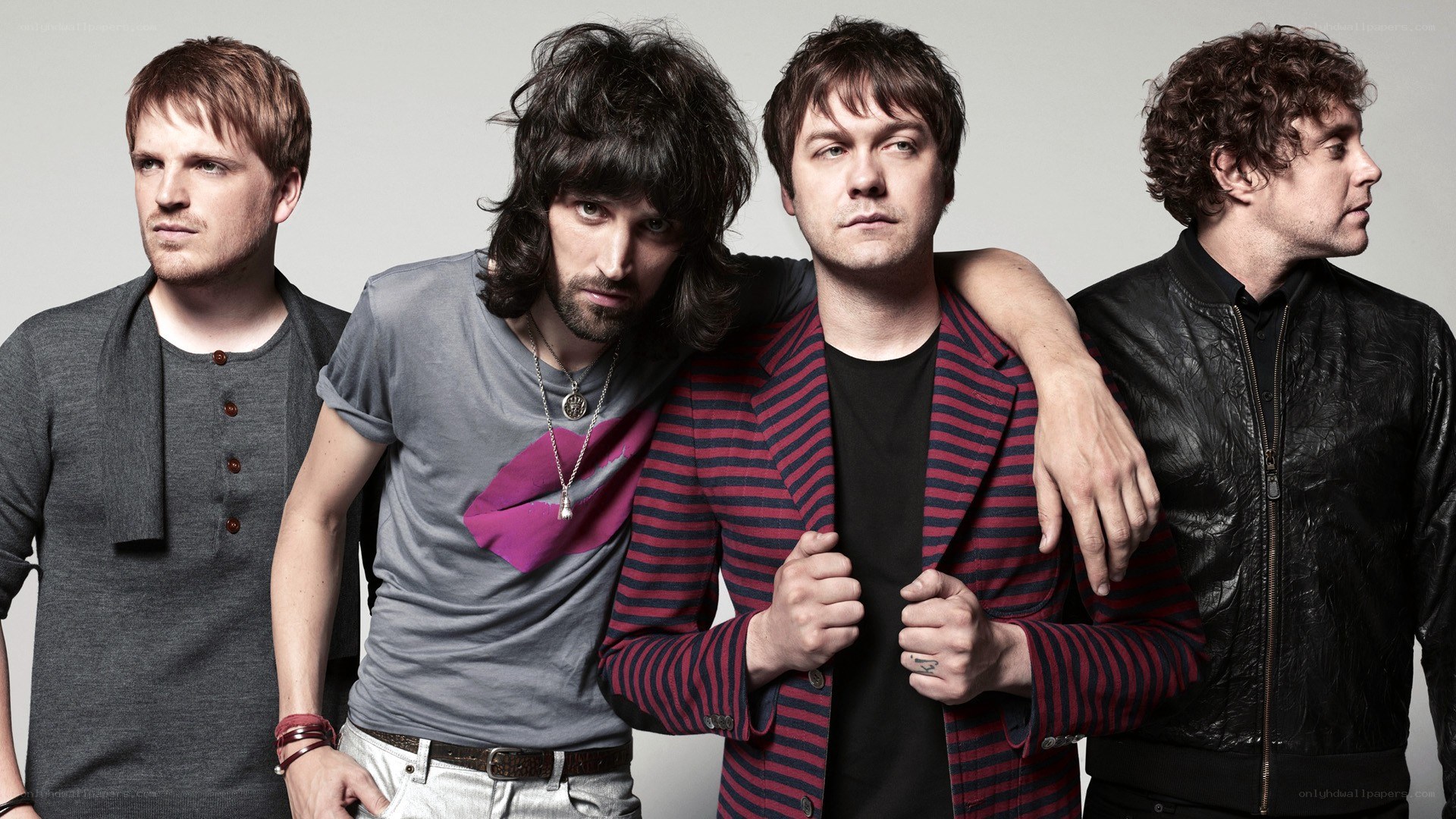 band members posing together