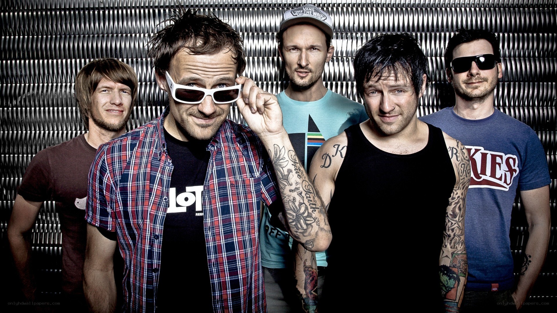 band members posing together