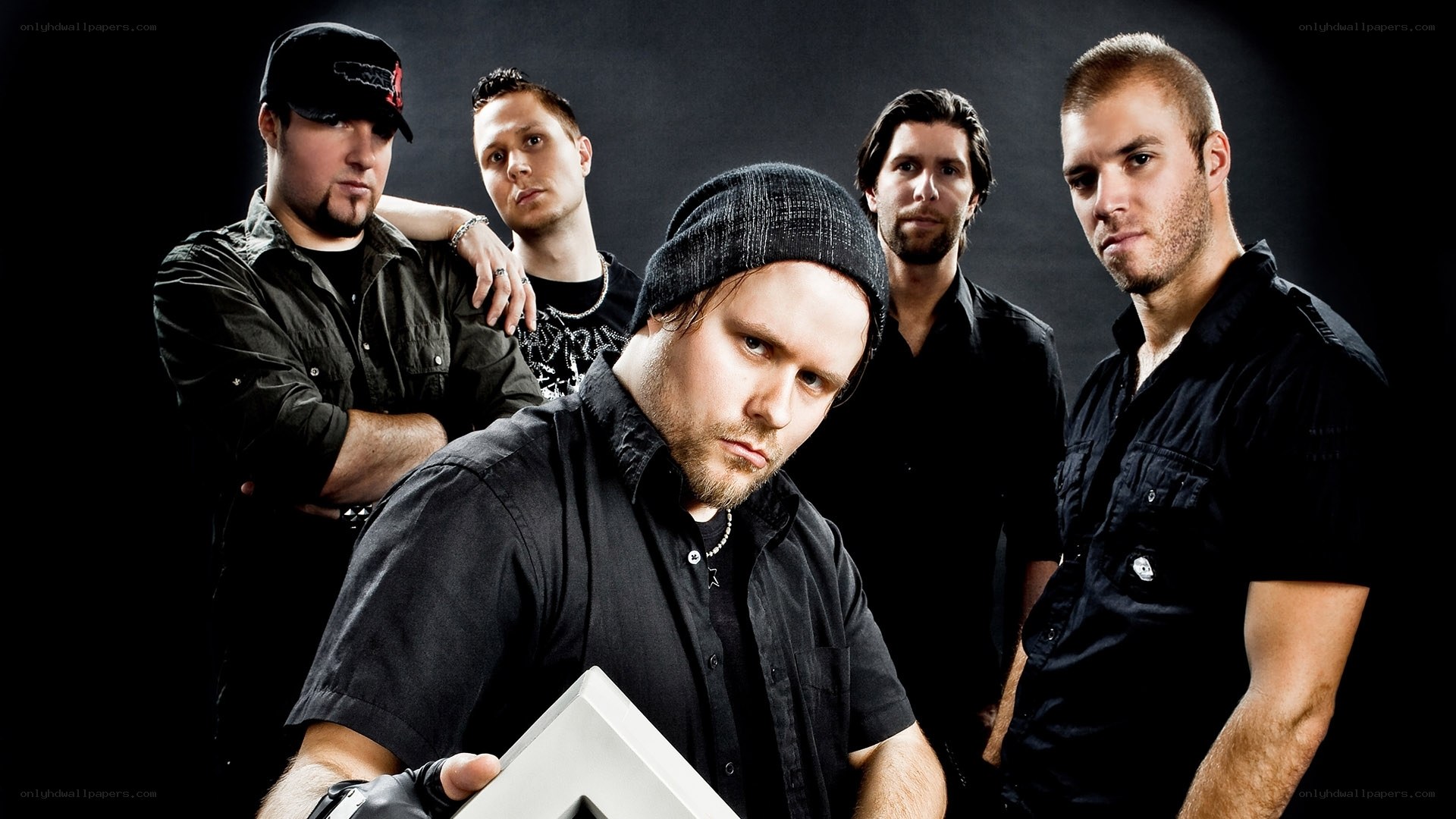 band members posing together