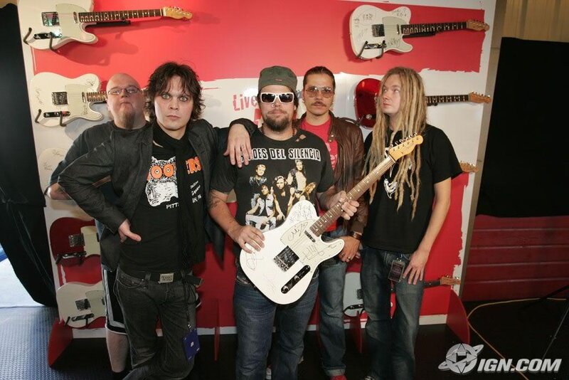Band Members Posing with Guitars