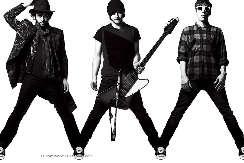 band members posing with instruments