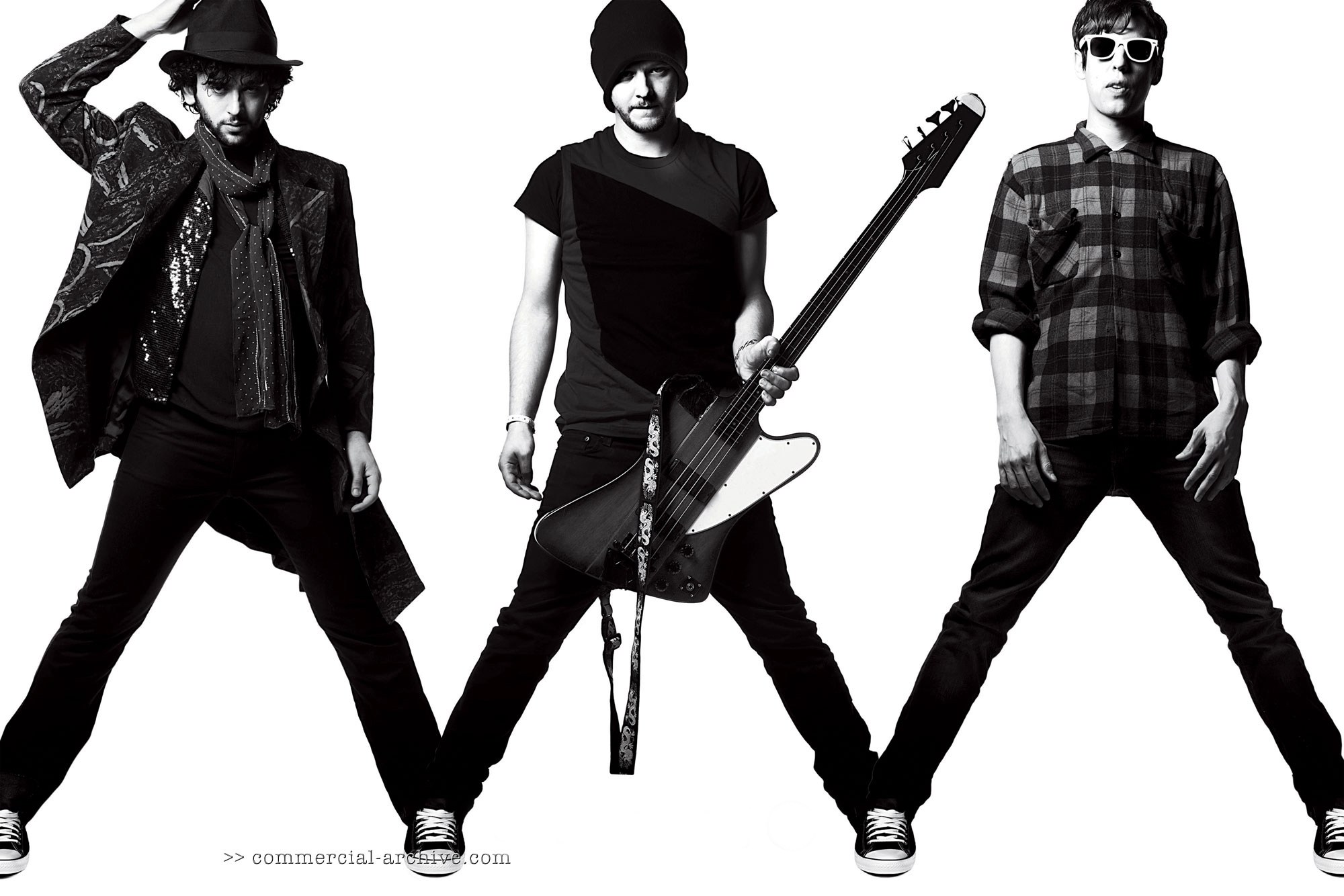 band members posing with instruments