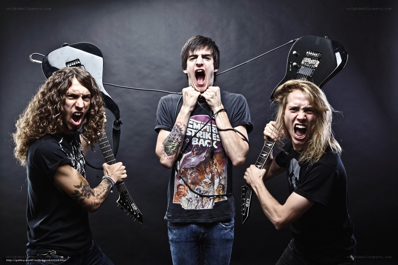 band members screaming with guitars