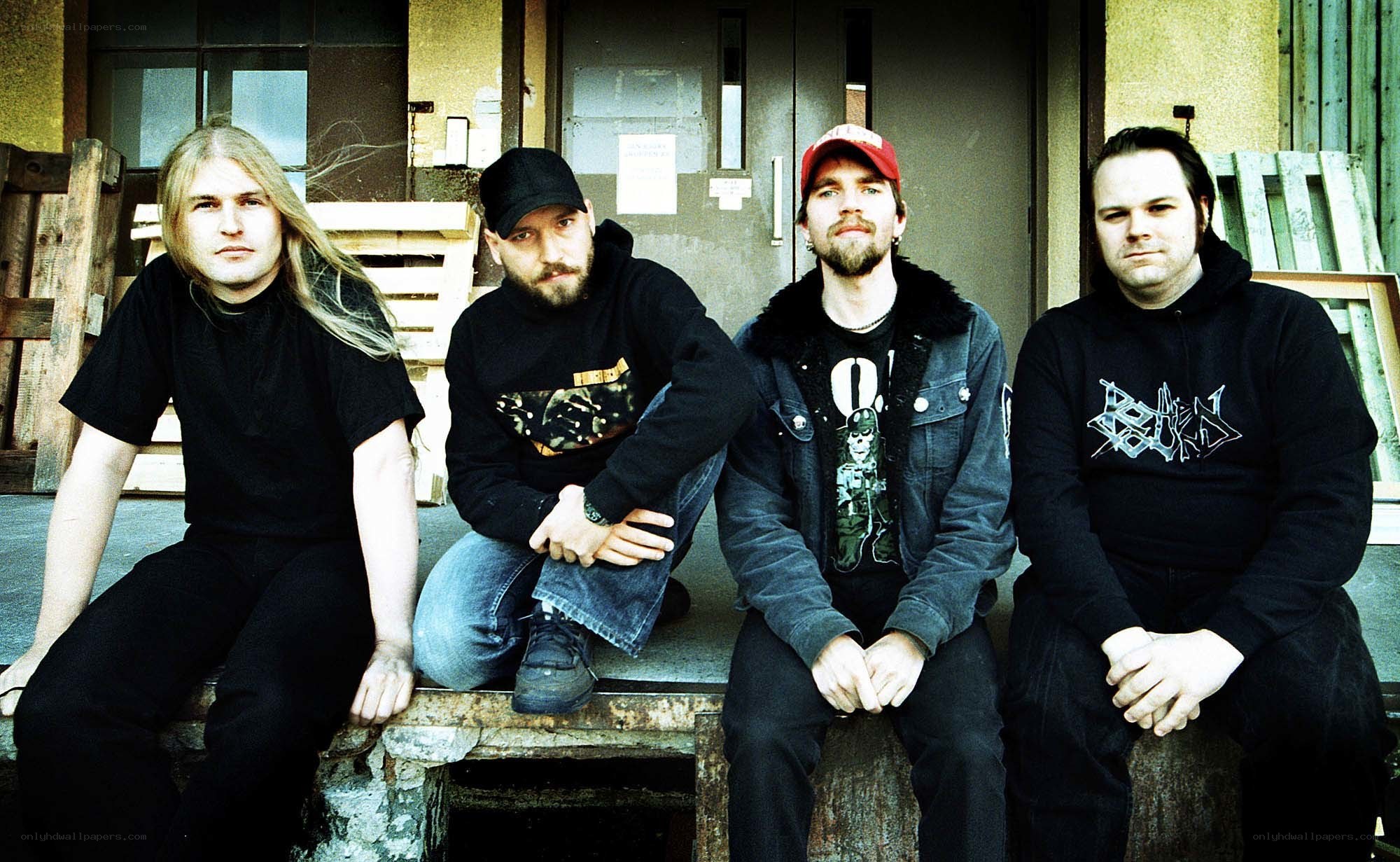 band members sitting on a bench