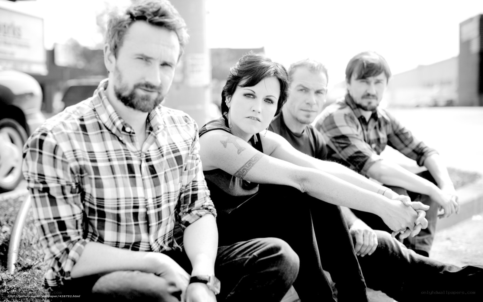 band members sitting outdoors