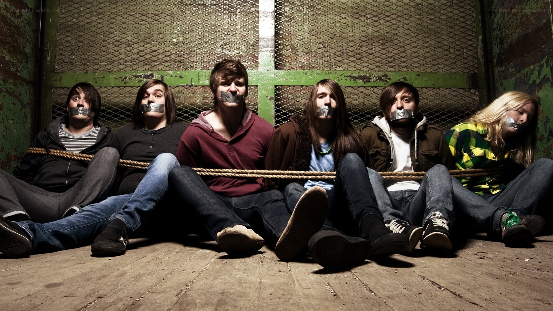 band members tied up in a room