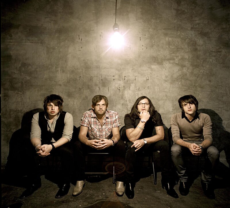 band members under a light bulb