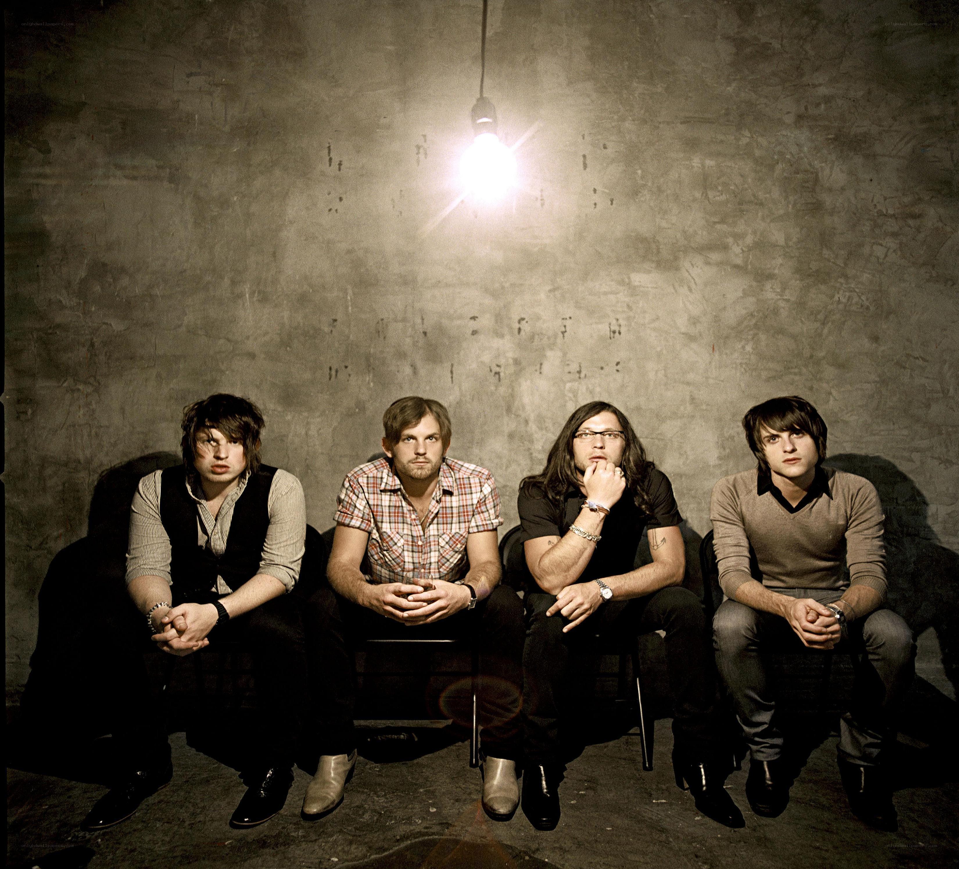 band members under a light bulb