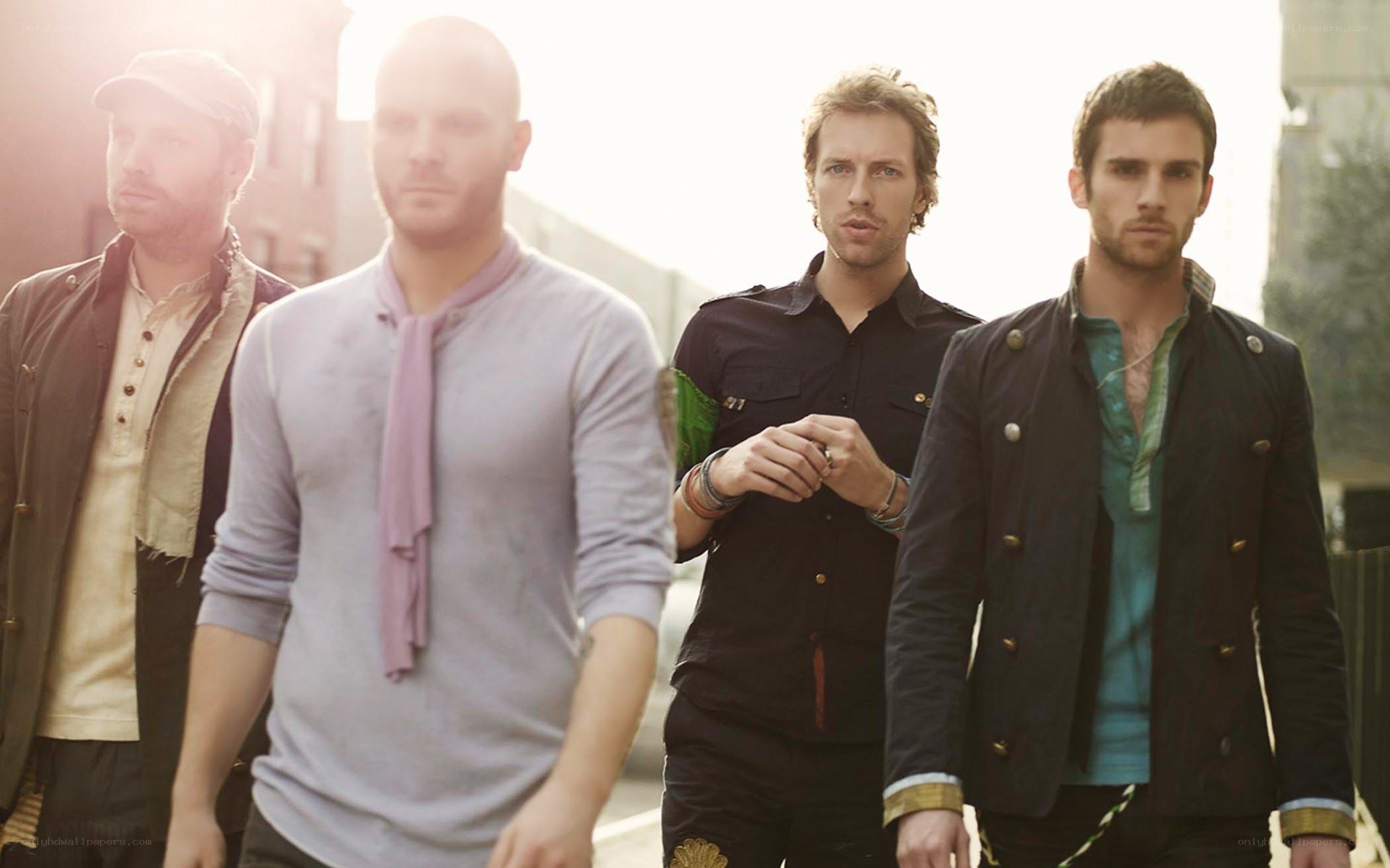 band members walking in sunlight