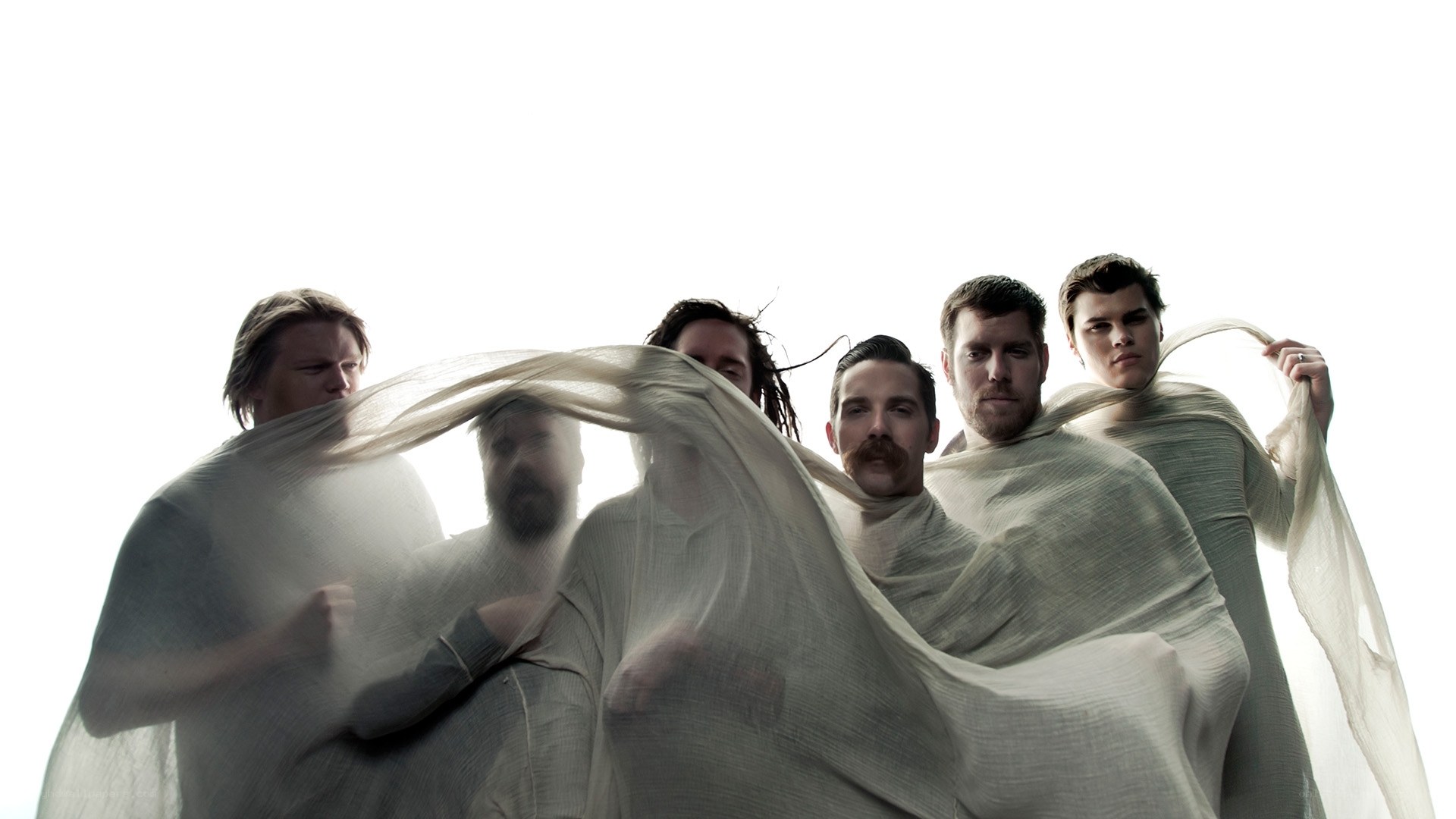 band members with flowing fabric