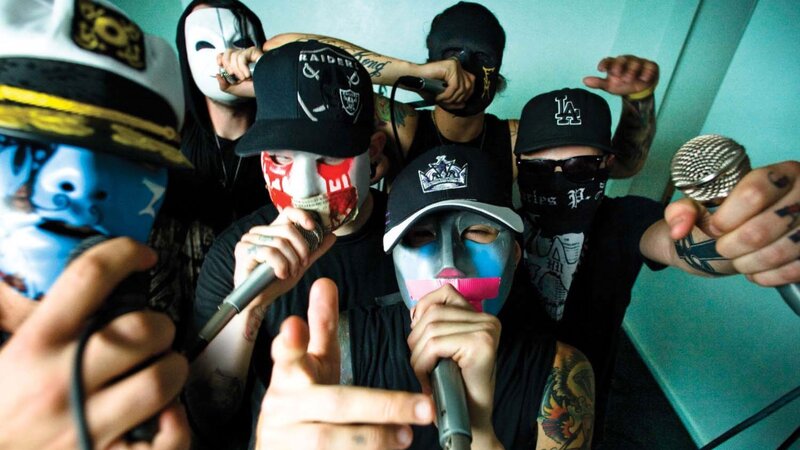 band members with masks and microphones