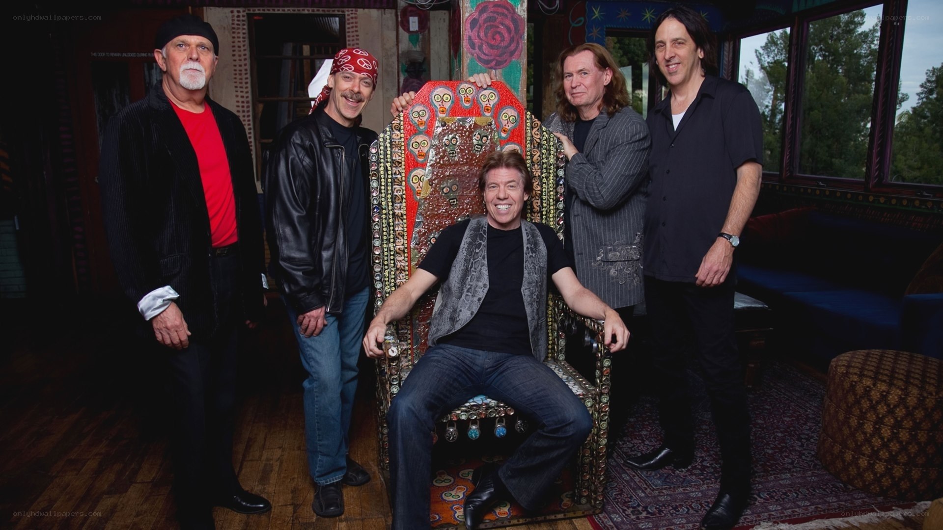 band members with ornate chair