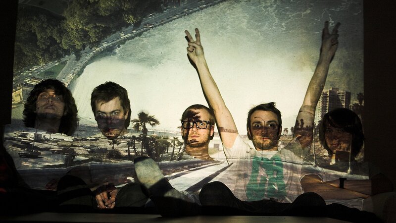 band members with peace signs