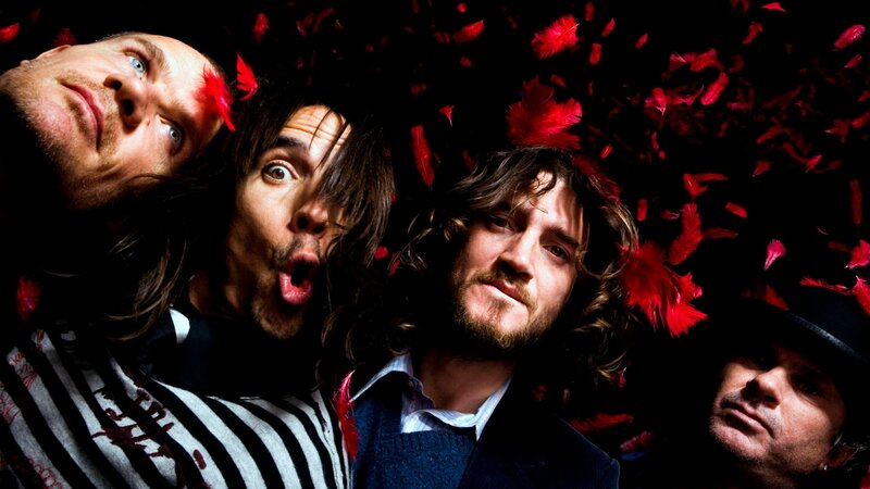 band members with red feathers