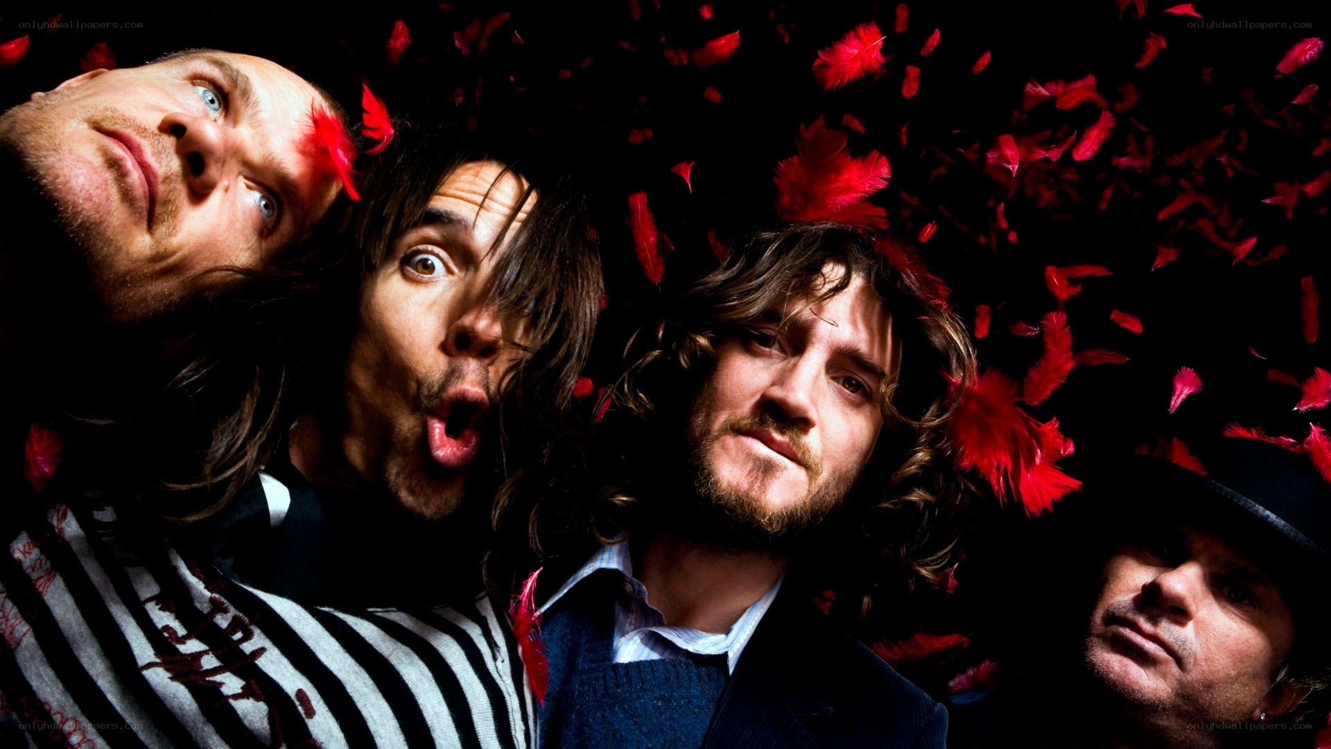 band members with red feathers