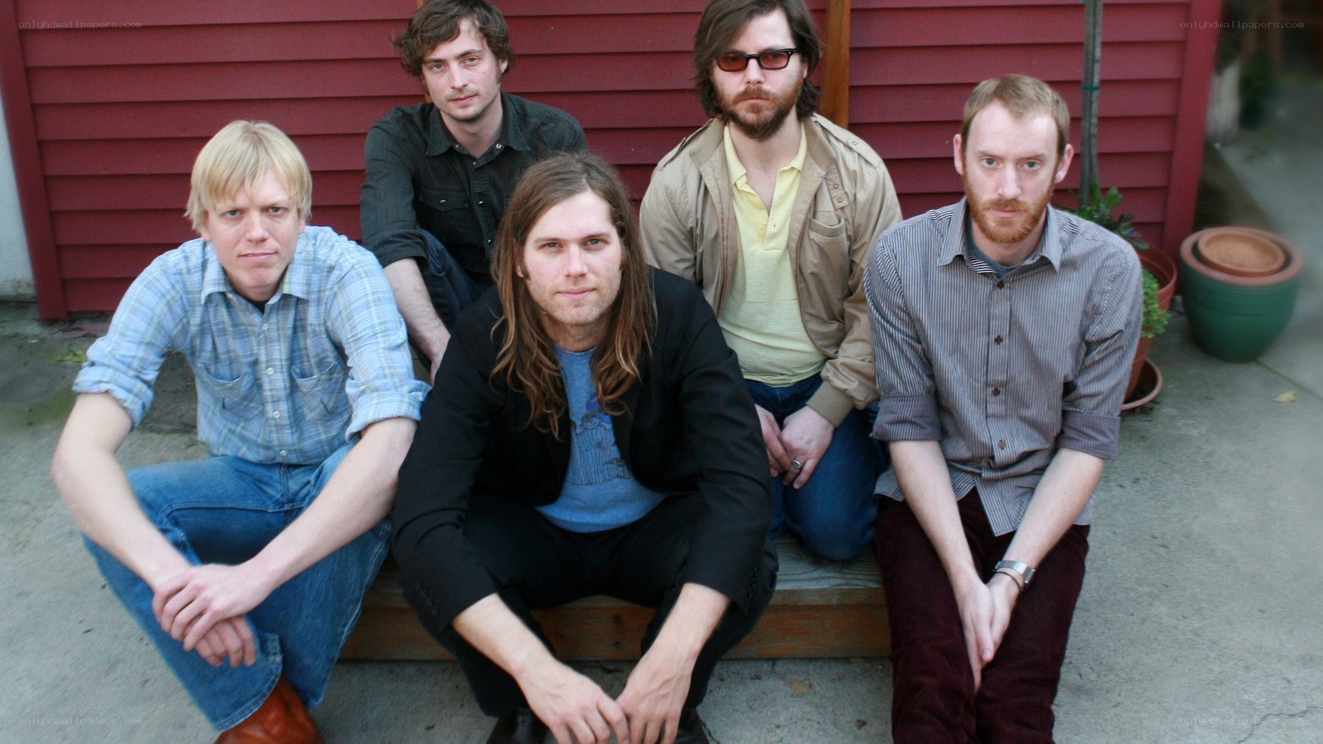 band of five men posing