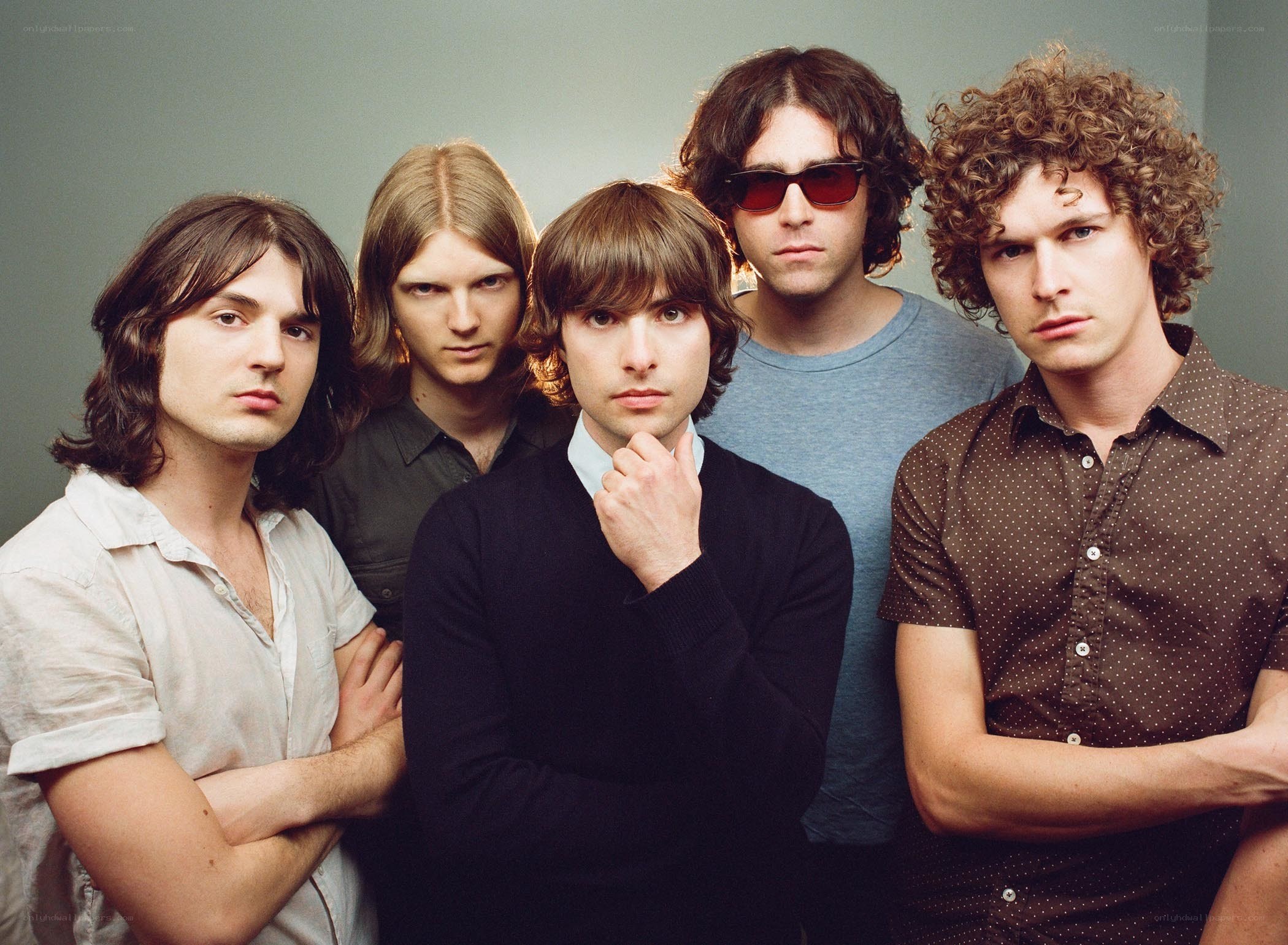 band of five men posing