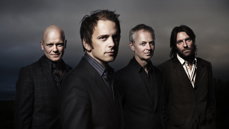 band of four men in suits