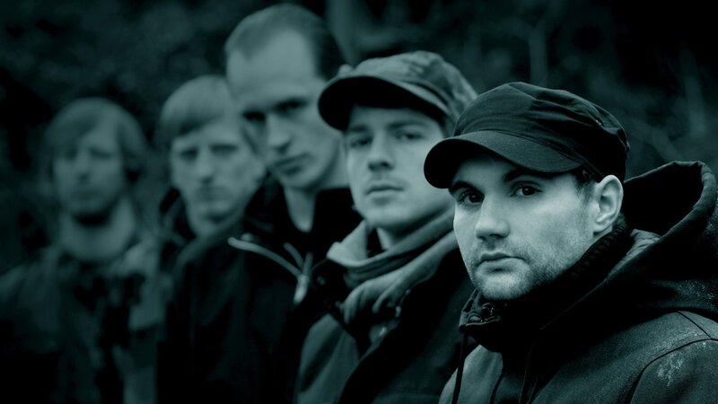 band of men in caps