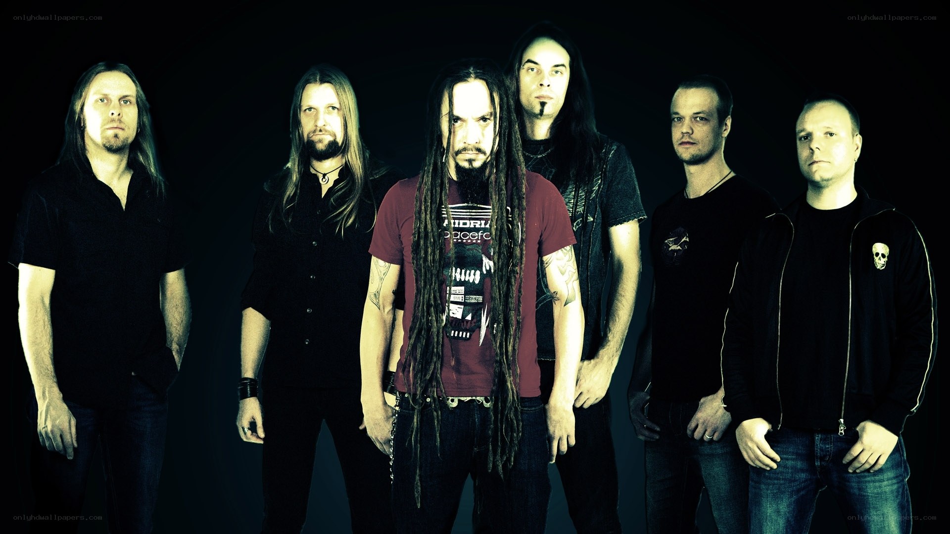 band of musicians in dark clothing
