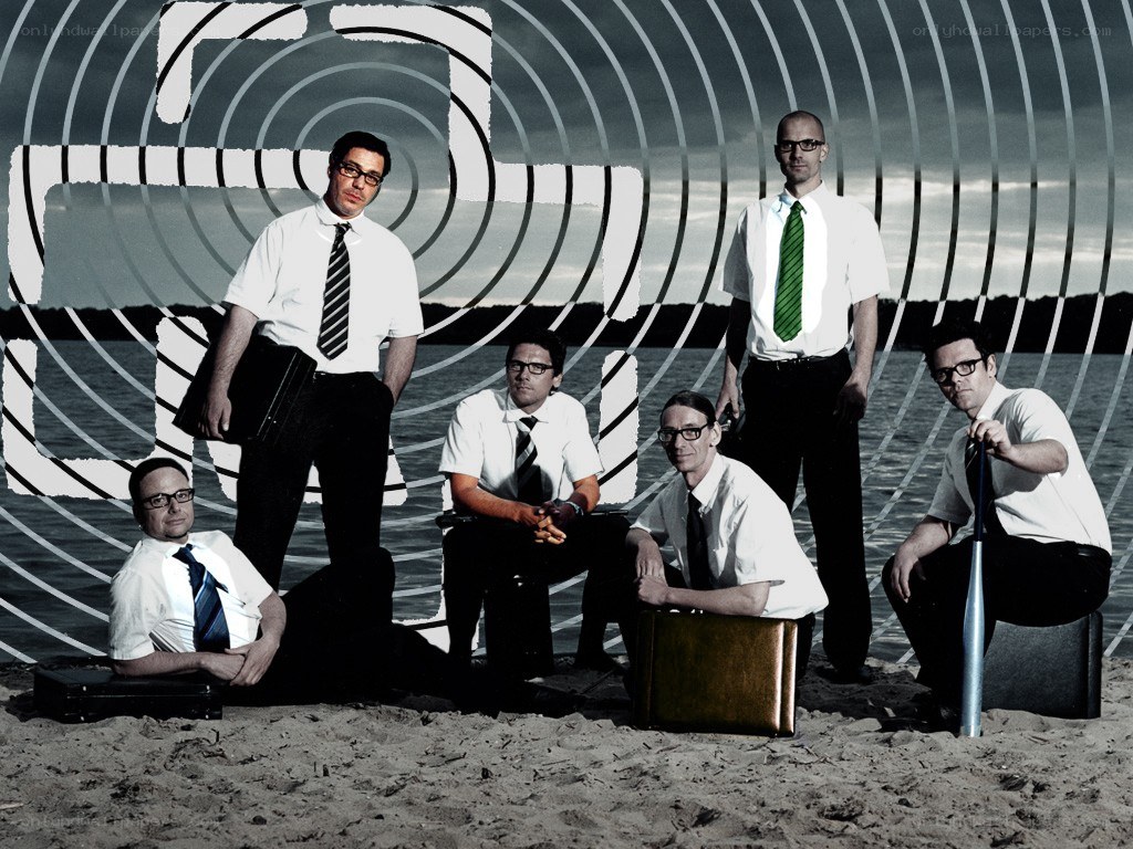 band on a beach with abstract graphics