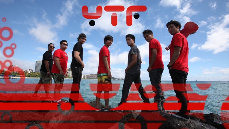 band on a beach with logo