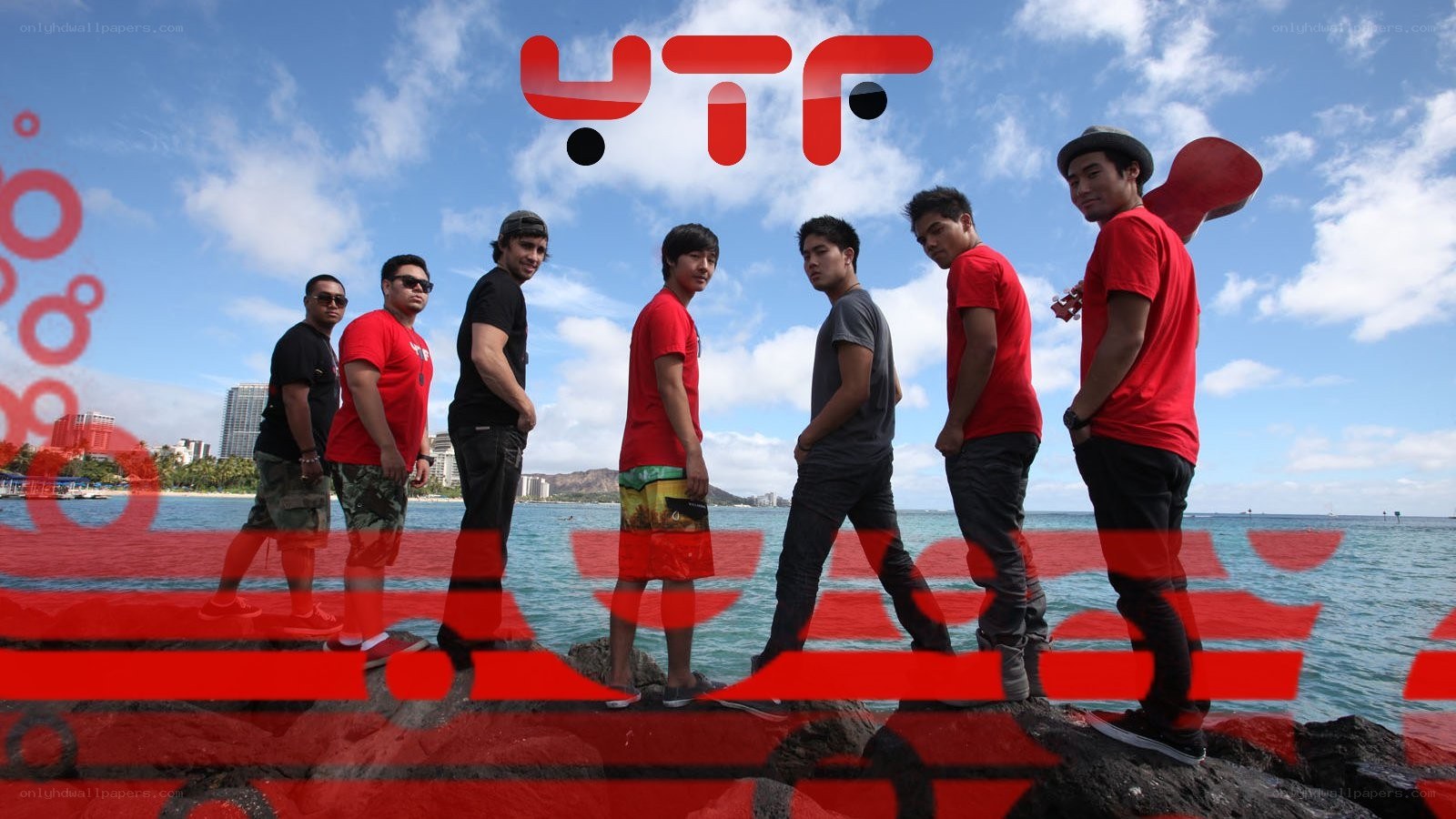 band on a beach with logo