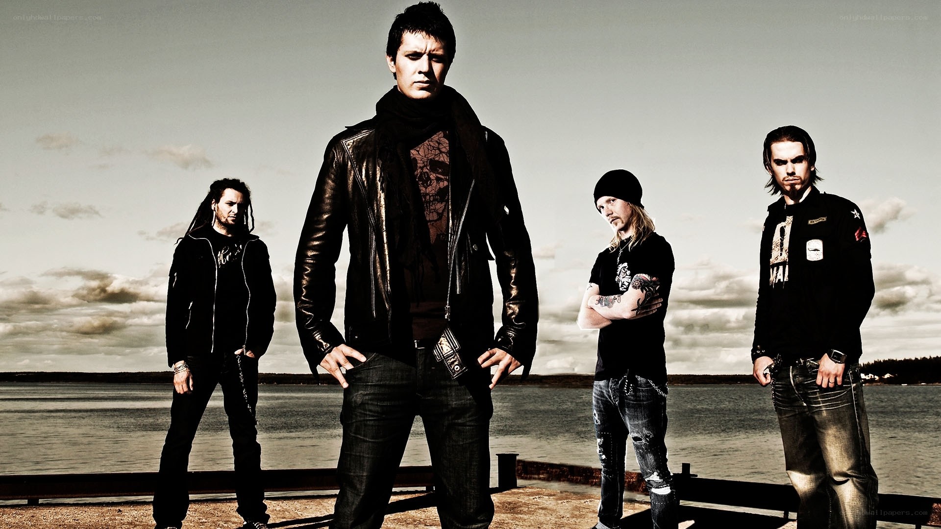 band on a dock by the water