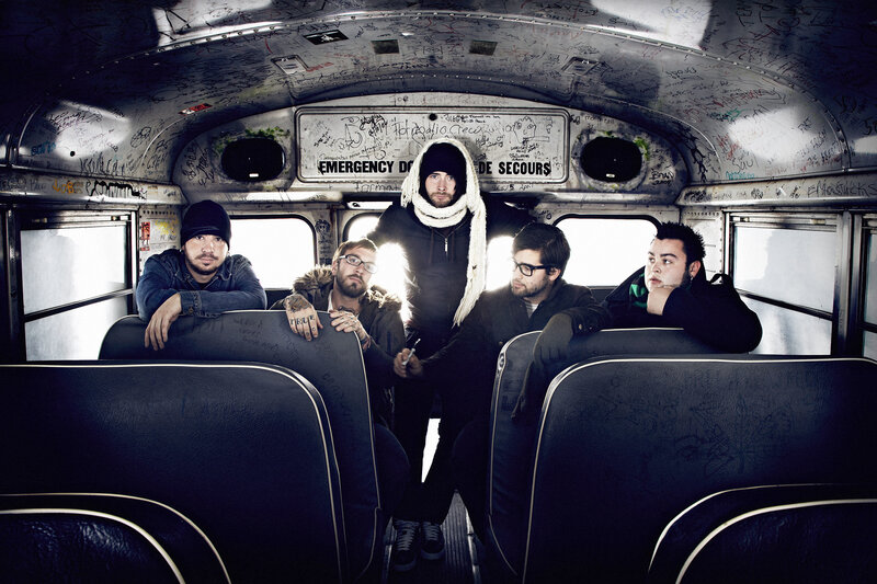 band on a graffiti-covered bus