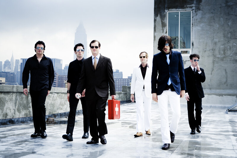 band on a rooftop with city view