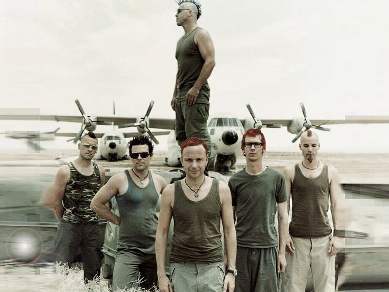 band on an airfield with planes