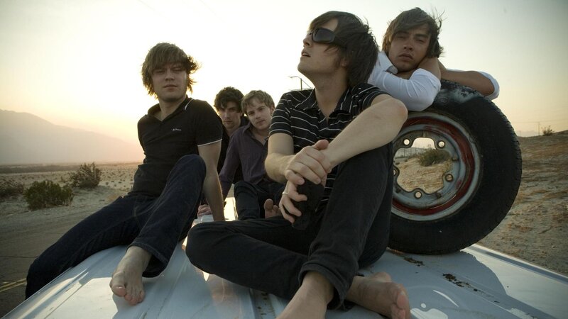 band on car roof at sunset