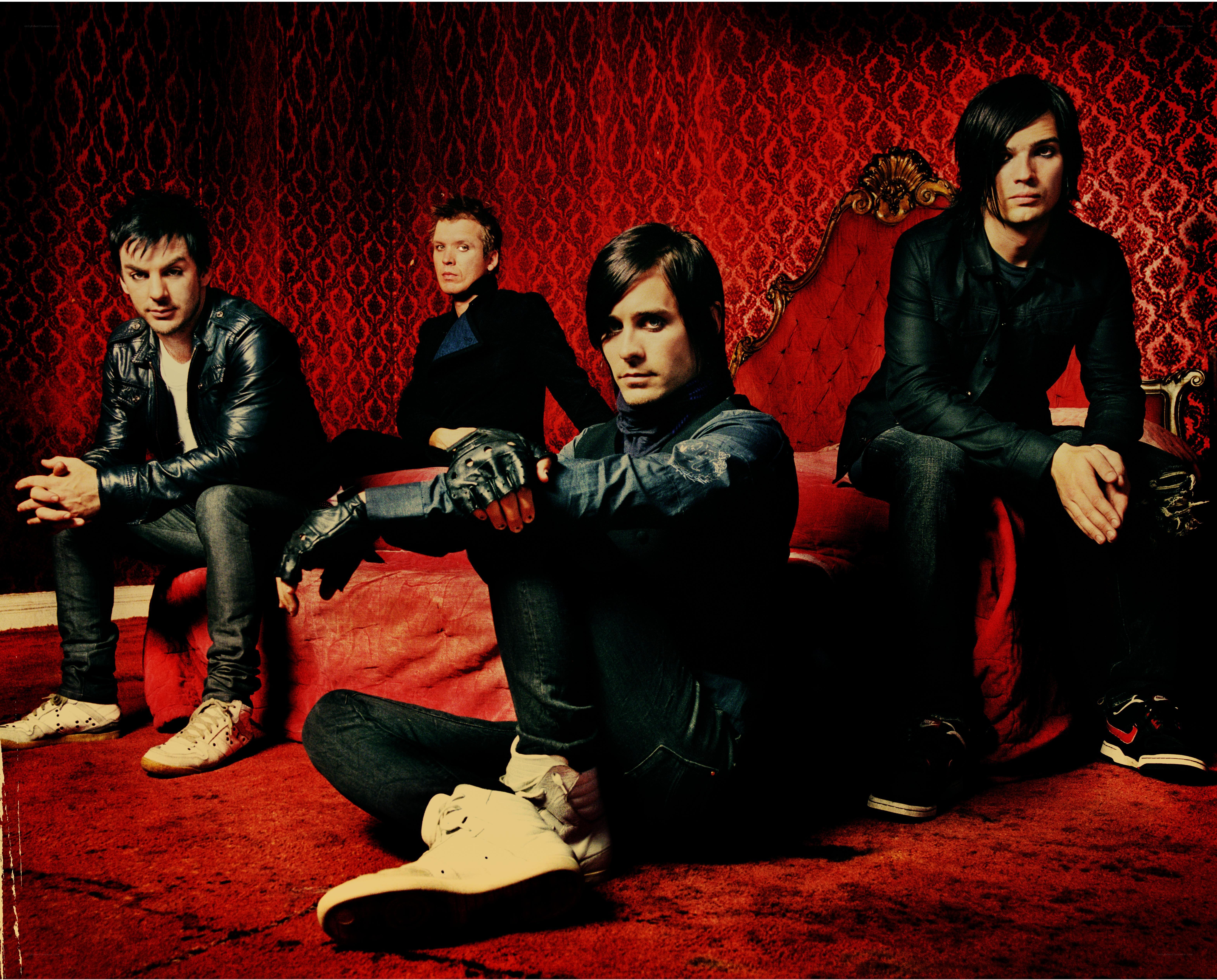 band on red couch