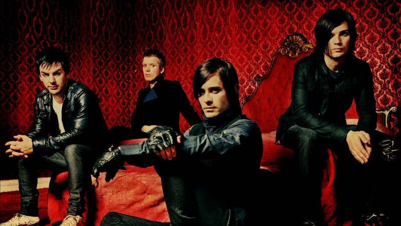 band on red couch