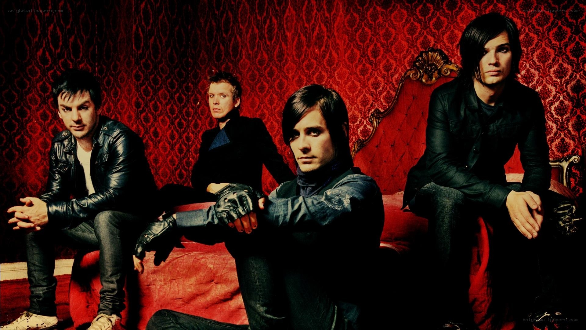 band on red couch