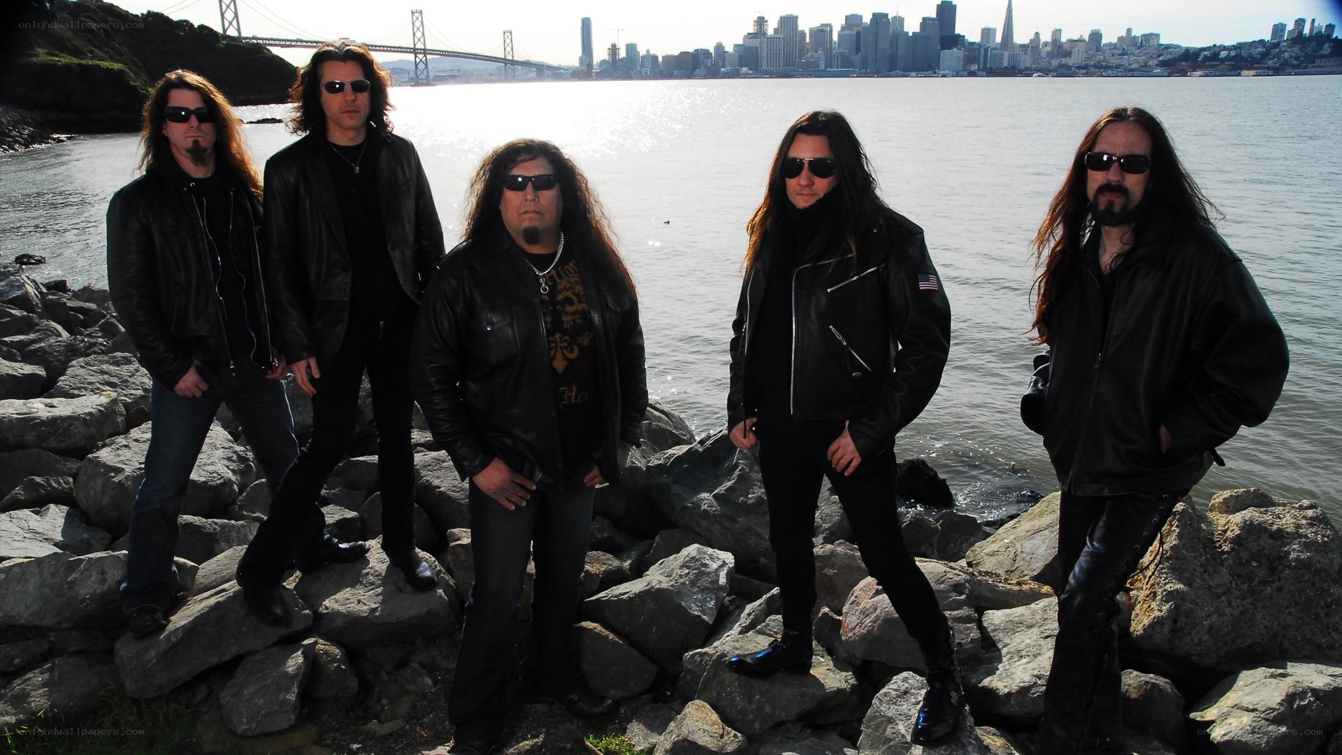 band on rocks by bay