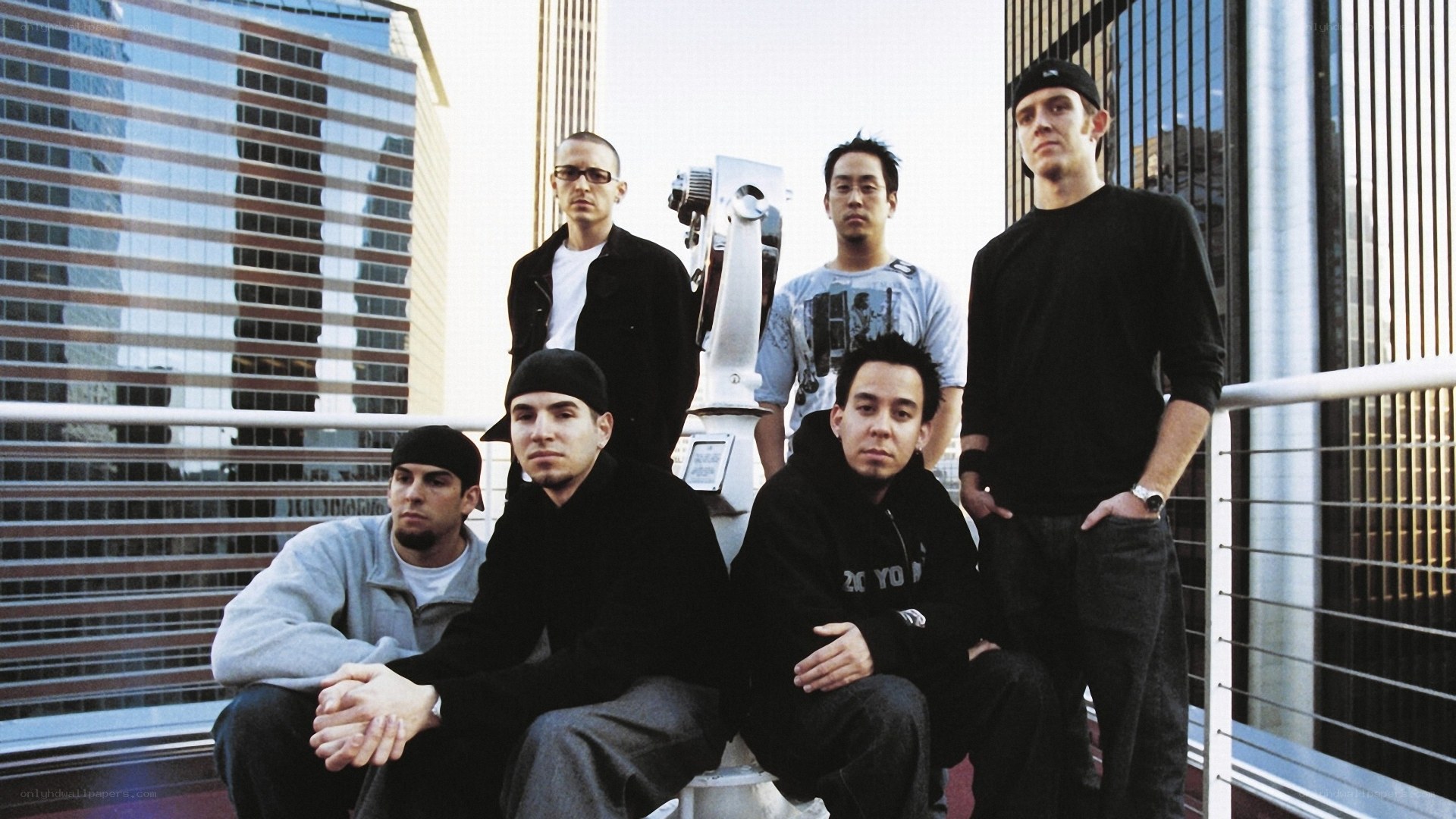 band on rooftop with city view