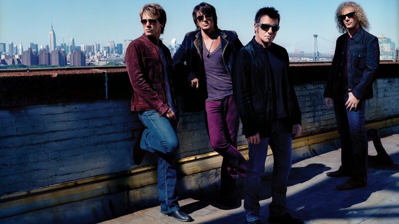 band on rooftop with city view