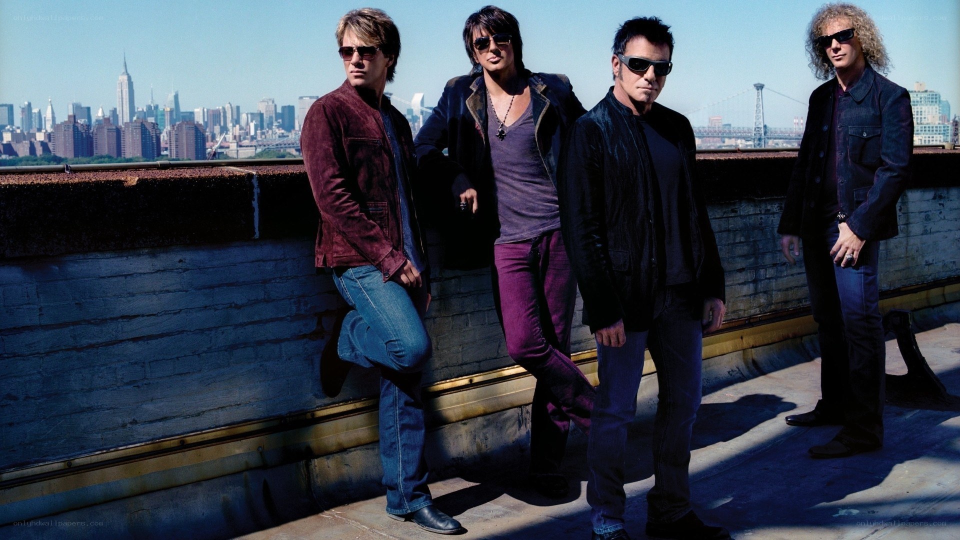 band on rooftop with city view