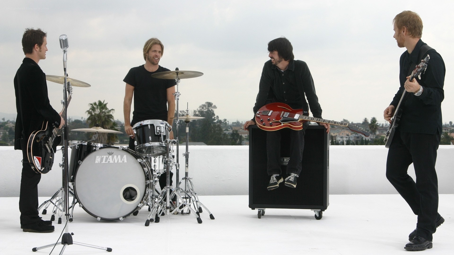 band on rooftop with instruments