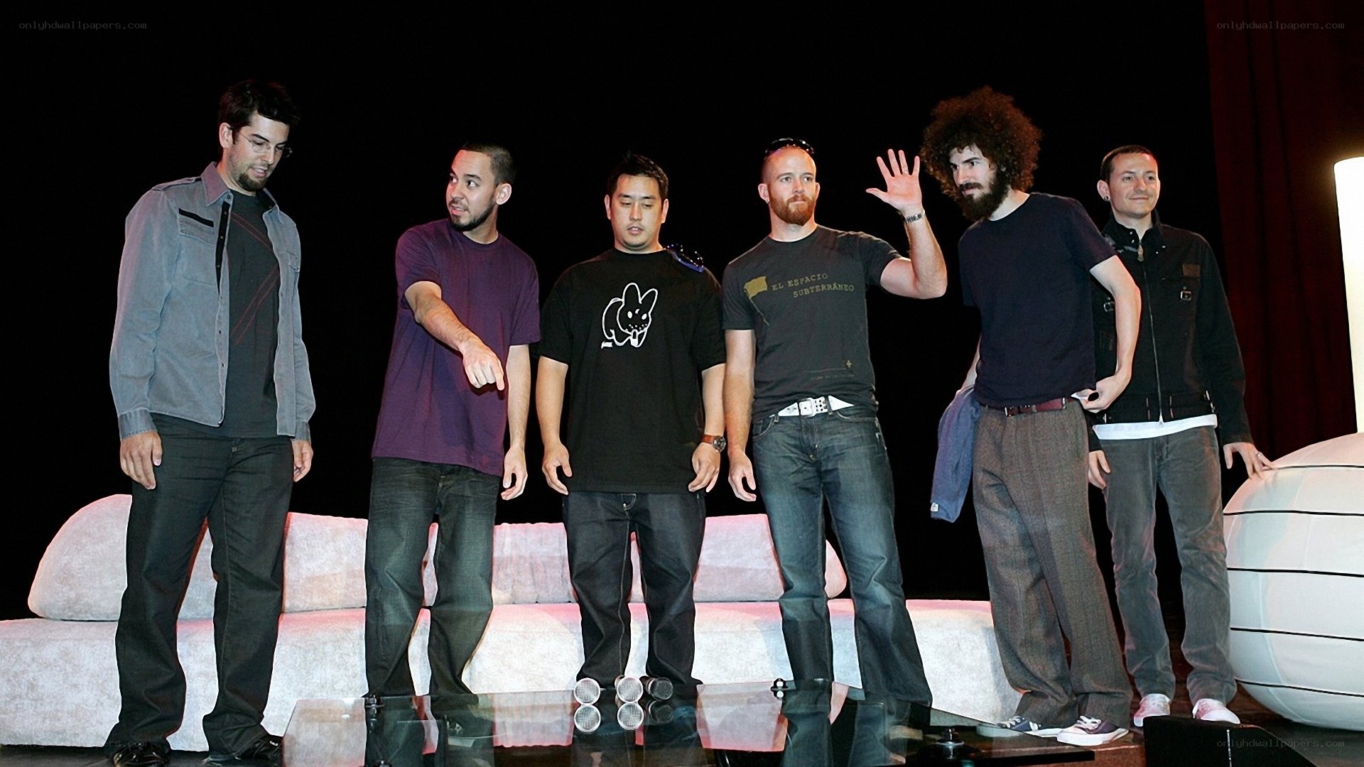 band on stage with couch
