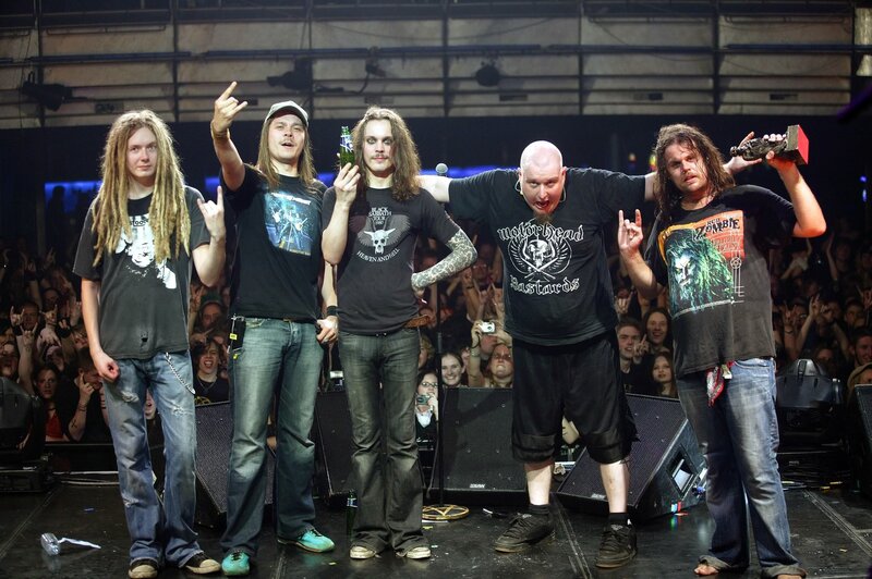 band on stage with crowd