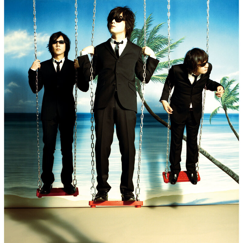 band on swings at beach