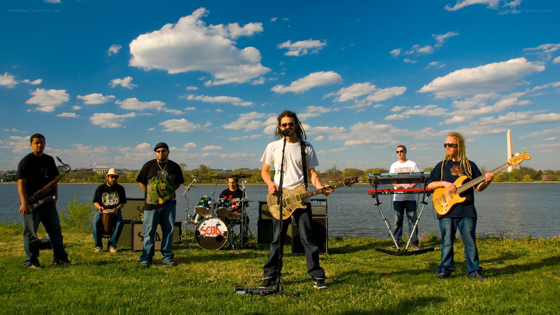 Band performing by the water