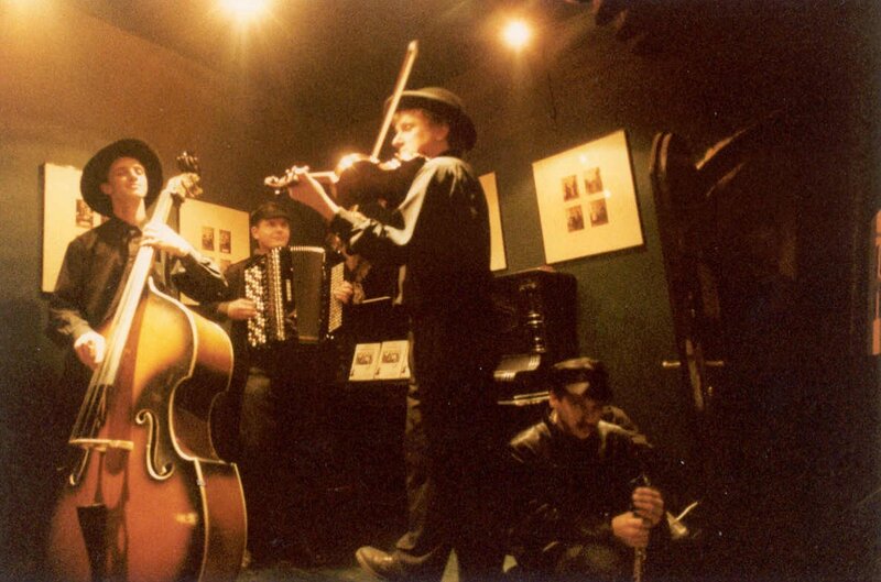 Band performing in a dimly lit venue