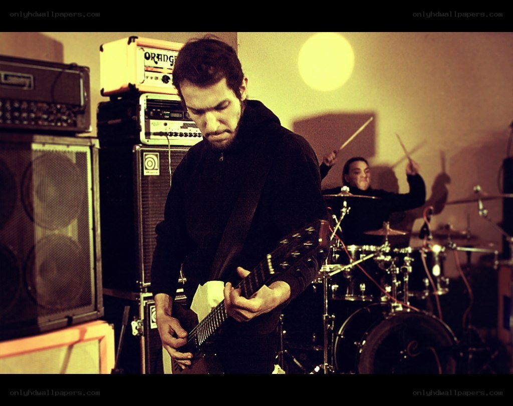 band performing in a practice space
