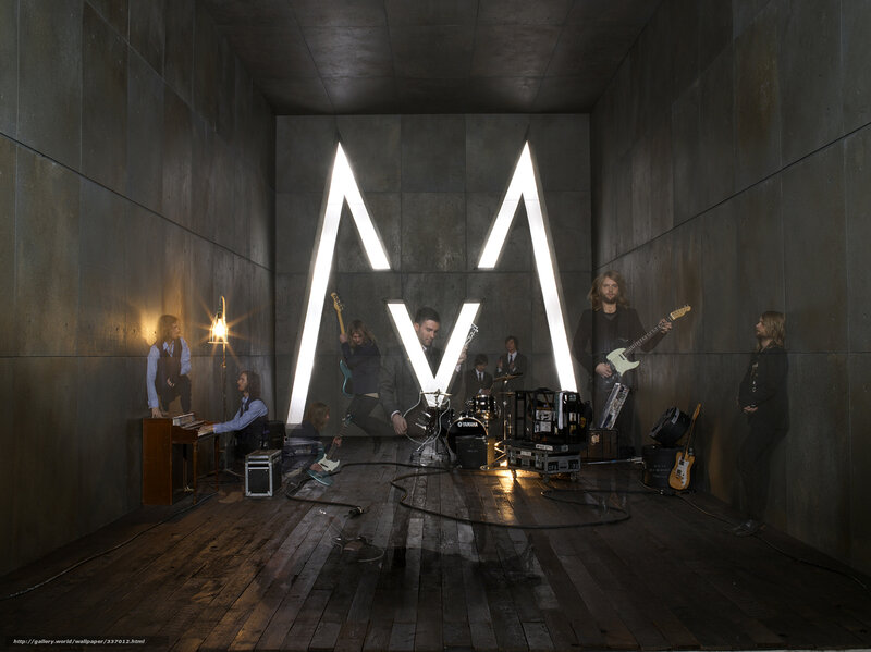 band performing in concrete room