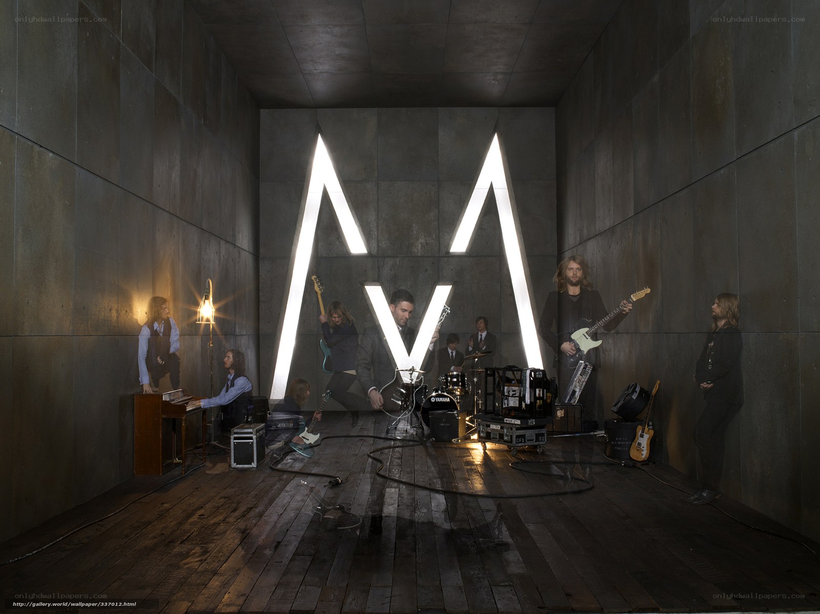 band performing in concrete room