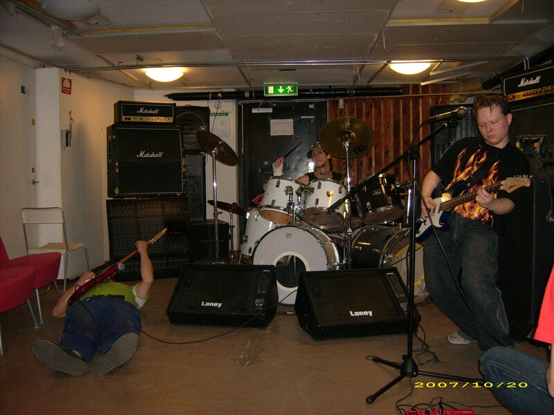 Band Performing in Room — Black