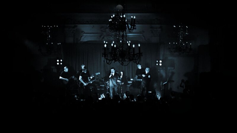 Band Performing on Stage — Black, Dramatic, Night, Photograph, Chandeliers